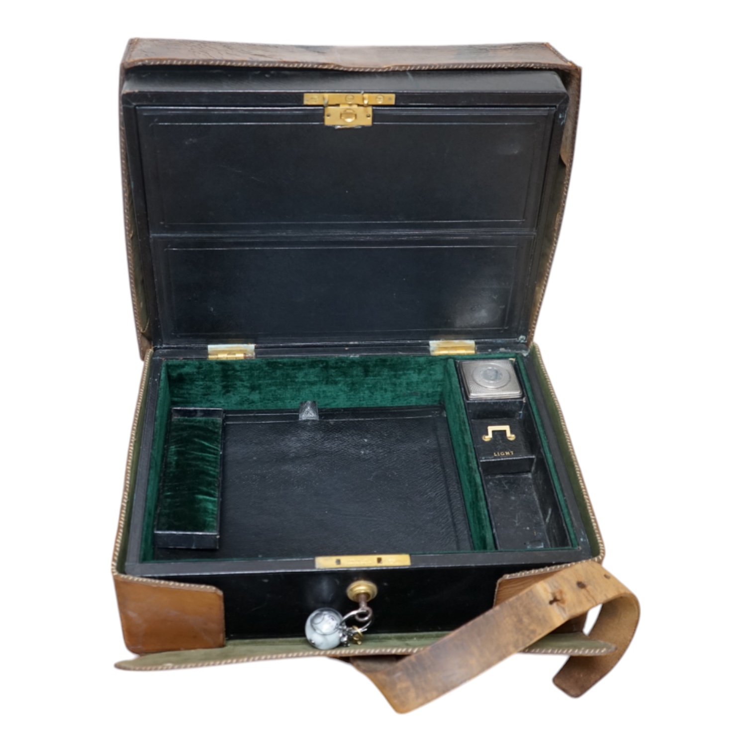 Wells & Lambert, London, a travelling writing box and outer leather case, with Bramah lock and keys, with monograms and inscriptions of Rev. George A. Robins, the box incorporating a silver lidded inkwell, 33cm wide. Con